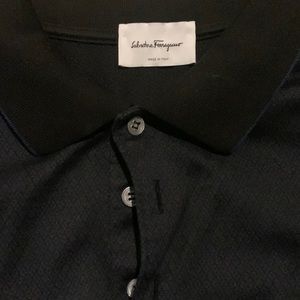 This is a midnight blue Salvatore Ferragamo three-bottom shirt for men.